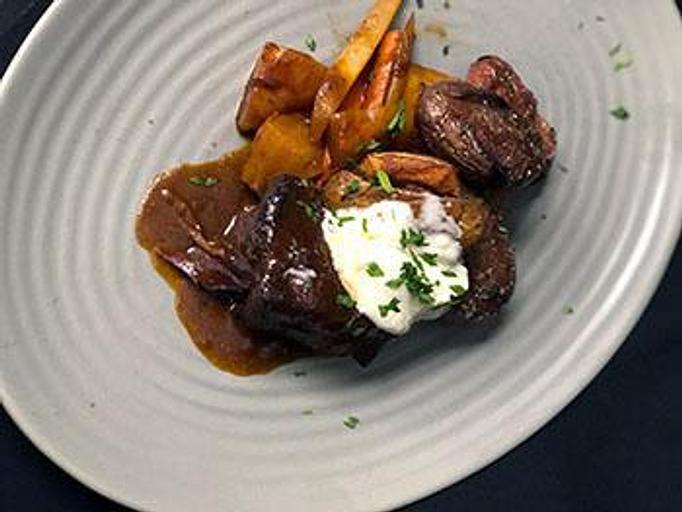 Product: Stewed root vegetables, crispy fingerling potatoes, horseradish crème fraiche and
red wine reduction - Phoenix City Grille in Madison - Phoenix, AZ American Restaurants