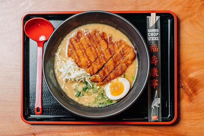 Product: traditional pork broth with mustard miso. served with tokyo wavy noodles, panko breaded pork loin, molten egg, shredded cabbage and green onion. topped with tonkatsu sauce - Ramen San in Chicago, IL Restaurants/Food & Dining