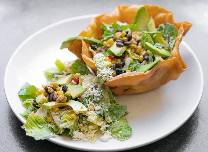 Product: Crispy tortilla bowl, romaine lettuce, black bean-corn salsa, avocado, queso fresco, chipotle Caesar dressing. - Red Mesa Restaurant in St Petersburg, FL Mexican Restaurants