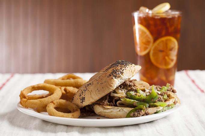 Product: Philly Cheesesteak Sandwich with Onion Rings - Saint's Restaurant & Catering in Southington, CT American Restaurants