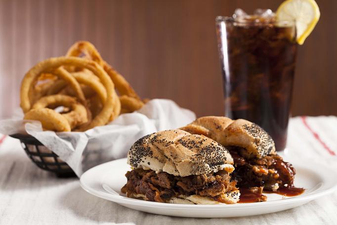 Product: Pulled Pork Sandwich with Onion Rings - Saint's Restaurant & Catering in Southington, CT American Restaurants