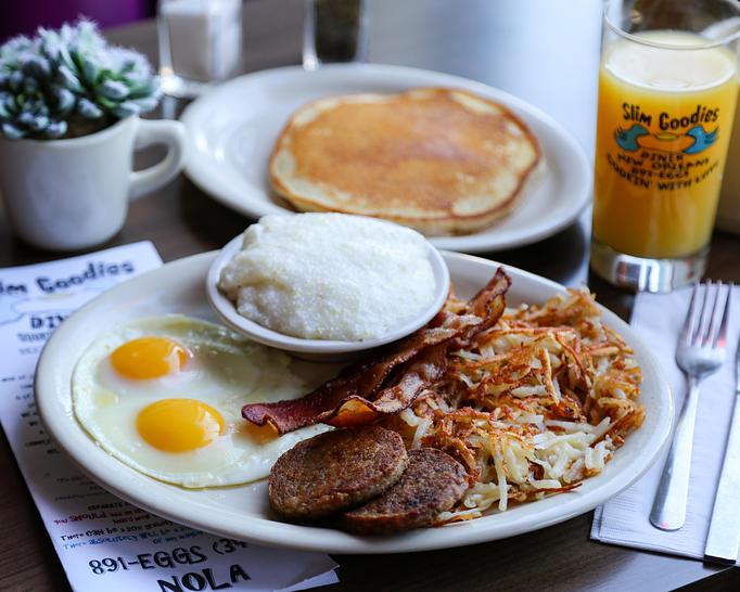 Product: Enjoy a full American Breakfast with Eggs your way complimented with bacon, sausage, hash browns and grits along with a Slimcake - hearty breakfast for the hardworking - Slim Goodies Diner in New Orleans, LA Vegetarian Restaurants