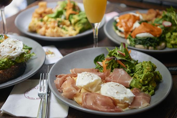 Product: two poached eggs, english muffin, piquillo sauce, patatas bravas, avocado, market greens; Choice Of bacon, smoked salmon or spinach - Socarrat Paella Bar - Chelsea in Chelsea - New York, NY Spanish Restaurants