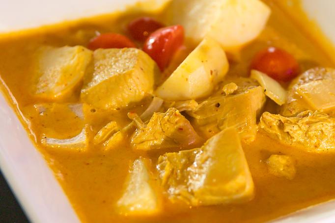 Product: This classic yellow curry made with chunks of chicken, potato, onion and tomato, and taste like one of those wonderful curry dishes you can find in the marketplaces and street of Bangkok. (Chicken only, no meat substitute available) - Thai Curry in Arlington, VA Thai Restaurants