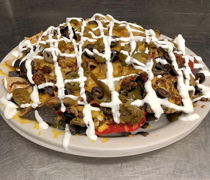 Product: BL Nachos with ground beef. - The Bottom Line in Farragut Square, Downtown - Washington, DC Pubs Product: BL Nachos with ground beef. - The Bottom Line in Farragut Square, Downtown - Washington, DC Pubs