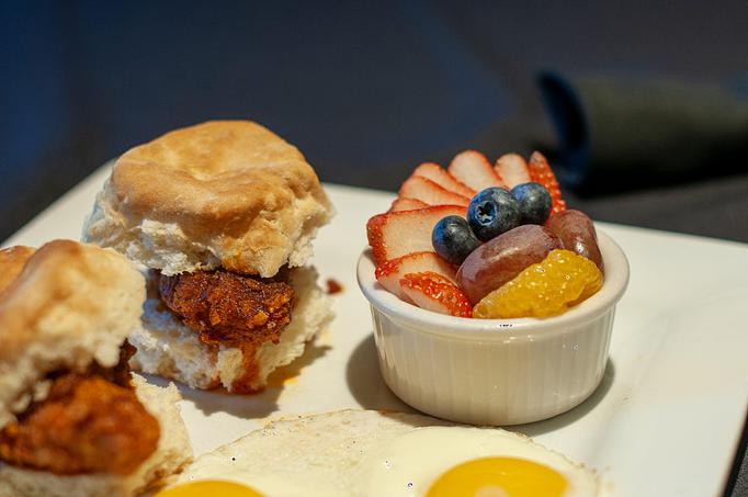 Product: Two Biscuits with fried Chicken tenderloin and two eggs any way served
with a side of Alabama white sauce & sausage gravy - also available “Nashville Hot” w/ Ranch. Served with your choice of home fries, fresh fruit or smoked gouda grits. - Midtown Cafe in Nashville, TN American Restaurants Product: Two Biscuits with fried Chicken tenderloin and two eggs any way served
with a side of Alabama white sauce & sausage gravy - also available “Nashville Hot” w/ Ranch. Served with your choice of home fries, fresh fruit or smoked gouda grits. - Midtown Cafe in Nashville, TN American Restaurants