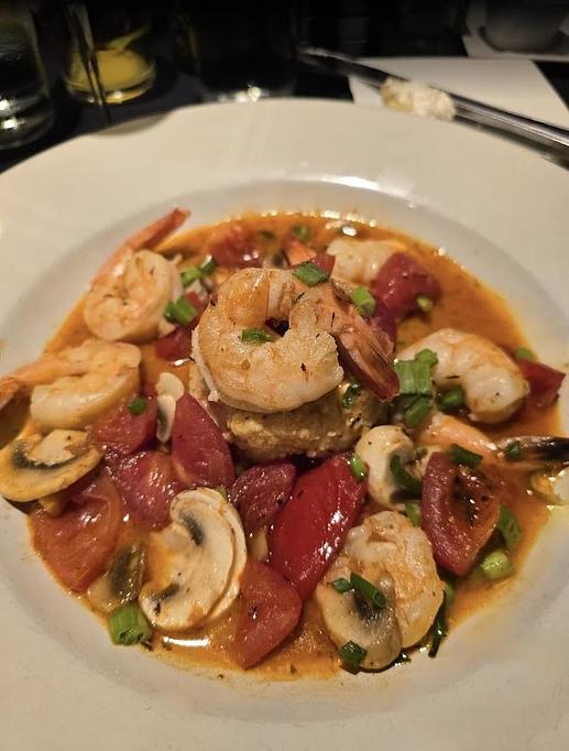 Product: Blackened shrimp tossed with bacon, mushrooms, tomatoes and scallions
served over stone ground smoked Gouda cheese grits. - Midtown Cafe in Nashville, TN American Restaurants Product: Blackened shrimp tossed with bacon, mushrooms, tomatoes and scallions
served over stone ground smoked Gouda cheese grits. - Midtown Cafe in Nashville, TN American Restaurants