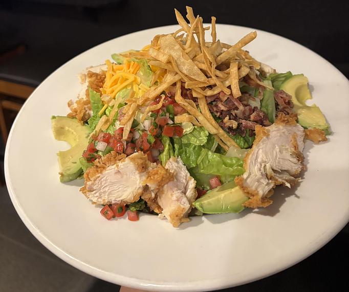 Product: Hand breaded 6oz chicken breast with romaine,
pico de gallo, black beans, avocado, cheddar cheese, applewood smoked bacon,
crispy tortilla strips & spicy ranch dressing. - Midtown Cafe in Nashville, TN American Restaurants Product: Hand breaded 6oz chicken breast with romaine,
pico de gallo, black beans, avocado, cheddar cheese, applewood smoked bacon,
crispy tortilla strips & spicy ranch dressing. - Midtown Cafe in Nashville, TN American Restaurants