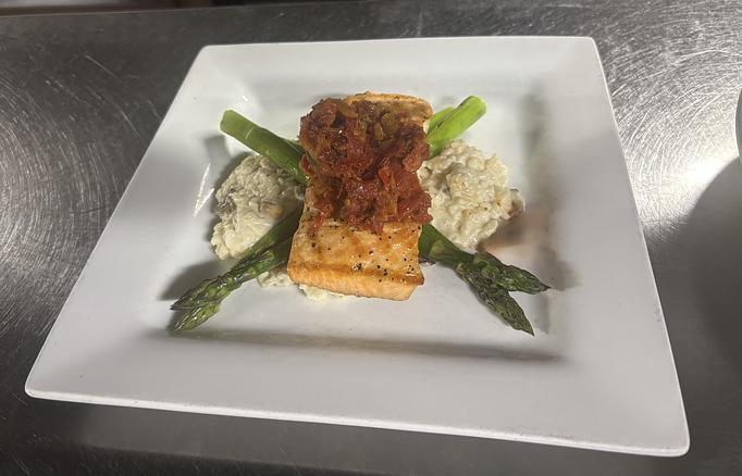 Product: On a bed of mushroom risotto with grilled asparagus
and sun-dried tomato ragout. - Midtown Cafe in Nashville, TN American Restaurants Product: On a bed of mushroom risotto with grilled asparagus
and sun-dried tomato ragout. - Midtown Cafe in Nashville, TN American Restaurants