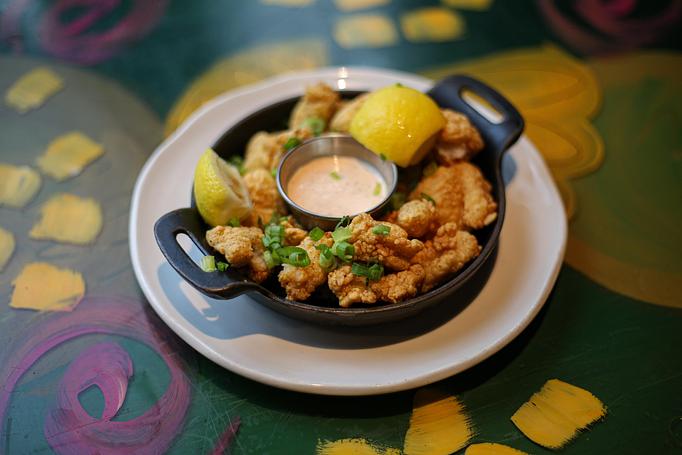 Product: Crispy Cajun Fish Bites - roasted red pepper remoulade - Red Fish Grill in French Quarter - New Orleans, LA American Restaurants