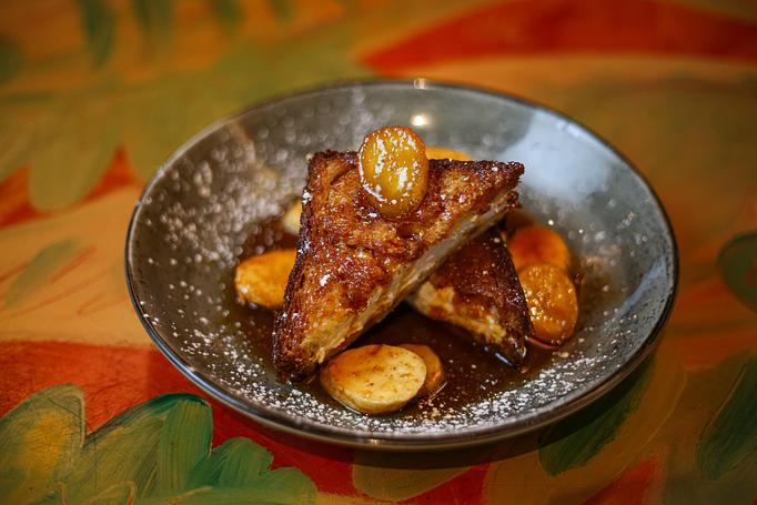 Product: brioche bread, cream cheese filling, Bananas Foster sauce - Red Fish Grill in French Quarter - New Orleans, LA American Restaurants