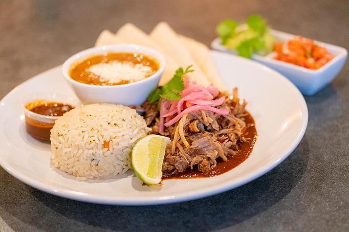 Product: Shredded carnitas, ancho tomatillo, pickled red onion, pico de gallo, guacamole. Cilantro rice & refried beans. Tortillas available upon request. (MGF) - Red Mesa Restaurant in St Petersburg, FL Mexican Restaurants Product: Shredded carnitas, ancho tomatillo, pickled red onion, pico de gallo, guacamole. Cilantro rice & refried beans. Tortillas available upon request. (MGF) - Red Mesa Restaurant in St Petersburg, FL Mexican Restaurants