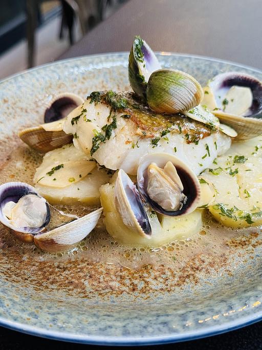Product: BACALAO CON BERBERECHOS | cod loin, lemon potato confit, white wine, cockles, garlic, pars - Socarrat Paella Bar - Chelsea in Chelsea - New York, NY Spanish Restaurants