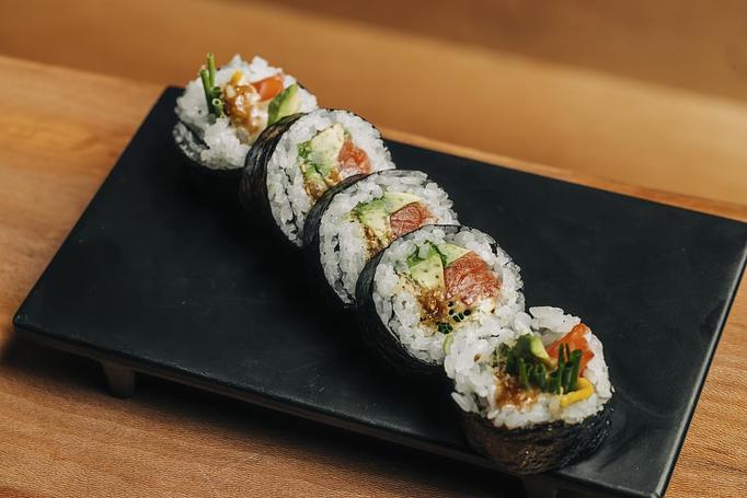 Product: zuke marinated salmon is dressed with gomae dressing and rolled with avocado, chives and a thin slice of meyer lemon. - Sushi San - Reservations in River North - Chicago, IL Japanese Restaurants
