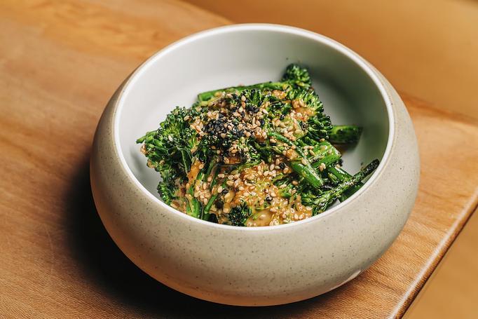 Product: broccolini is blanched before getting a quick char in our coal-fired oven. served chilled and tossed in a savory goma-ae dressing made of roasted sesame seeds, sesame oil, garlic, and other spices. - Sushi San - Reservations in River North - Chicago, IL Japanese Restaurants