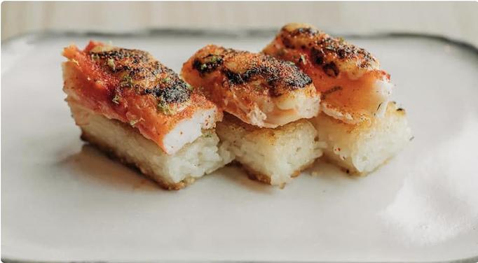 Product: succulent merus-cut alaskan king crab, topped with lime-soy glaze and torched, sits atop crispy, caramelized sushi rice. - Sushi San - Reservations in River North - Chicago, IL Japanese Restaurants