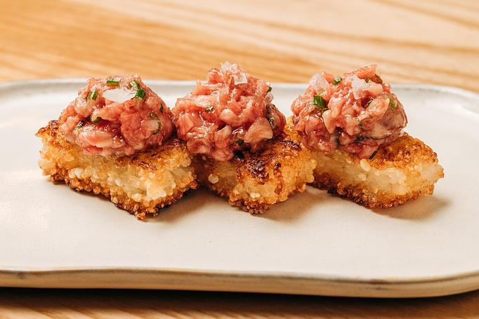 Product: crispy pressed rice topped with chopped ohba leaf, chopped wagyu, chive, salt, and toasted sesame seeds. - Sushi San - Reservations in River North - Chicago, IL Japanese Restaurants