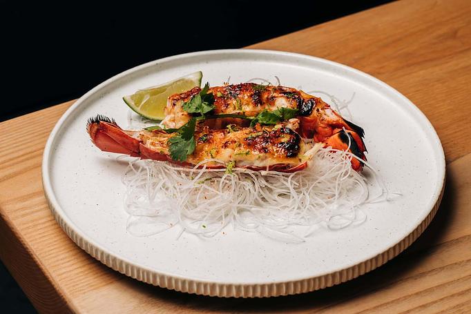 Product: half of a maine lobster served in the shell, prepared chopstick-friendly and perfectly complimented by a lime-soy glaze before being caramelized in our coal-burning oven. - Sushi San - Reservations in River North - Chicago, IL Japanese Restaurants