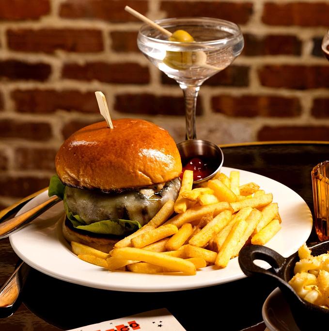 Product: The Django | Jazz Club and Restaurant in Downtown NYC | The Django Burger - served with onion jam, cheddar, lettuce, tomato, and black pepper mayo. Make it an Impossible Burger +4. - The Django in TriBeCa - New York, NY American Restaurants