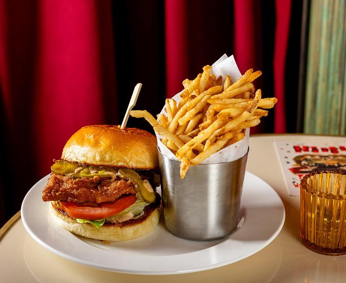 Product: The Django | Jazz Club and Restaurant in Downtown NYC | Fried Chicken Sandwich - Django spice marinated chicken thigh, bread & butter pickles, old bay mayo, lettuce, tomato - The Django in TriBeCa - New York, NY American Restaurants