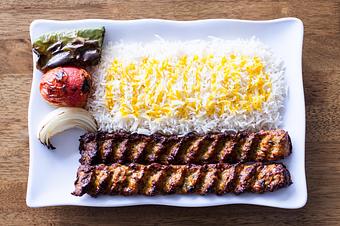 Product: Chicken koobide is a traditional Persian kabob (ground Chicken) marinaded with onion and seasoned well, cook on open flame to perfection, served on bed of basmati rice and grilled veggie. - Aiden's Grill in la crescenta / montrose / sunlandtujunga  /goendale - Glendale, CA Mediterranean Restaurants