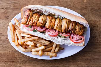Product: Chicken thigh sandwich made with, mayo, parsley, onion, tomato, lettuce on your choice of bread, French roll or lavash wrap (thin bread) - Aiden's Grill in la crescenta / montrose / sunlandtujunga  /goendale - Glendale, CA Mediterranean Restaurants