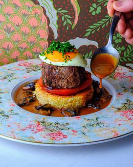 Product: Tournedo Brennan

Petit Filet, Sunny-Side-Up Egg, Creole Tomato, Brandied Mushroom Sauce - Brennan's - Wine Cellar in French Quarter - New Orleans, LA Cajun & Creole Restaurant