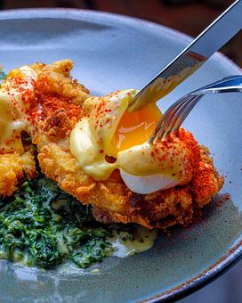 Product: Eggs Sardou

Crispy Artichokes, Parmesan Creamed Spinach, Choron Sauce - Brennan's - Wine Cellar in French Quarter - New Orleans, LA Cajun & Creole Restaurant