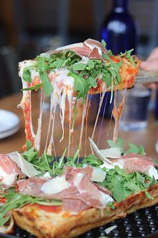Product: 1st Place Campionato Mondiale Della Pizza - Parma, Italy 2013: Signature Pizza Sauce / Prosciutto di Parma / Capicolla / Burrata and Mozzarella / Fresh Arugula / EVOO / Shaved Parmigiano Reggiano - Brown Dog Pizza in Downtown Telluride, Main Street - Telluride, CO Bars & Grills