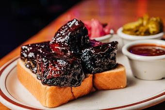Product: Thick slice of Texas toast topped with brisket burnt ends meat tossed in barbecue sauce - Bub City in Rosemont, IL Barbecue Restaurants