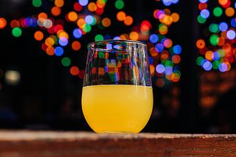 Product: Stemless wine glass containing orange juice-based cocktail - Bub City in Rosemont, IL Barbecue Restaurants
