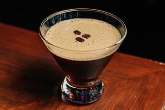 Product: Stemless martini glass containing a coffee-colored cocktail topped with foam and three espresso beans - Bub City in Rosemont, IL Barbecue Restaurants