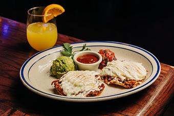 Product: Two tostadas on a white plate served with guacamole, salsa and pico de gallo - Bub City in Rosemont, IL Barbecue Restaurants