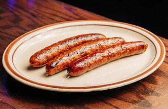 Product: Three breakfast sausage links on a white plate - Bub City in Rosemont, IL Barbecue Restaurants