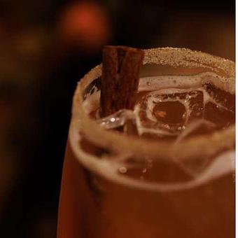 Product: Cranberry juice, orange juice, cinnamon, ginger ale. Garnished with a cinnamon stick and cinnamon and sugar rim. - Chateau Faire Le Pont Winery in Wenatchee, WA American Restaurants