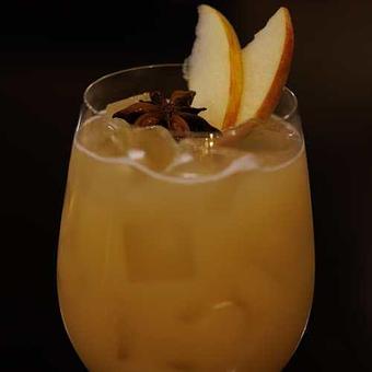 Product: Apple cider, caramel, vanilla, cinnamon, ginger ale. Garnished with an anise star and fresh cut apple. - Chateau Faire Le Pont Winery in Wenatchee, WA American Restaurants