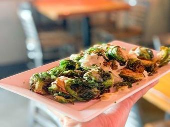 Product: Crispy, Caramelized & Full of Flavor! Our roasted Brussel sprouts bursting with deliciousness. A must-try side at Geddy's! - Geddy's in Downtown Bar Harbor, just steps from the town pier. - Bar Harbor, ME American Restaurants