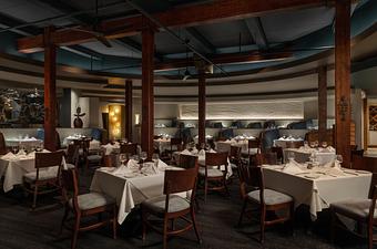 Interior: GW Fins' dining room offers comfortable table and booth seating. - GW Fins in French Quarter - New Orleans, LA Seafood Restaurants