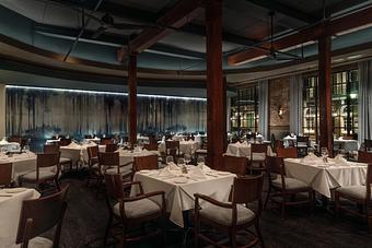 Interior: GW Fins' Main Dining Room features floor-to-ceiling windows with beautiful views of the French Quarter. - GW Fins in French Quarter - New Orleans, LA Seafood Restaurants