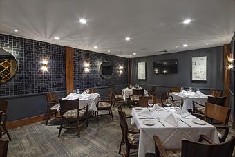 Interior: GW Fins' Private Dining Room features a 52" flat-screen TV, as well as Wi-Fi and teleconferencing capabilities. - GW Fins in French Quarter - New Orleans, LA Seafood Restaurants