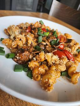 Product: Cavatappi noodles, baked Italian sausage meatballs in a bolognese "Sunday Sauce" (red wine and marinara) and Alfredo blush sauce, with mushrooms, grape tomatoes, breadcrumbs, parmesan and basil. - Harvey's Grill and Bar in Saginaw, MI American Restaurants