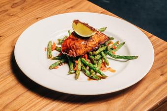 Product: salmon fillet glazed with a sweetened soy marinade, served with seasonal vegetables. finished with lime and fried sage - Hub 51 in River North - Chicago, IL American Restaurants