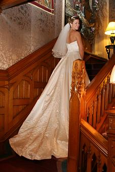 Interior: Bride on Staircase - Briarhurst Manor in Manitou Springs, CO Restaurants/Food & Dining