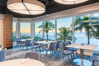 Interior: Our dining room with beachfront views. - Cōste Island Cusine in Fort Myers Beach, FL American Restaurants