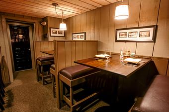 Interior: high top bar tables - Harrison's Restaurant & Bar in Stowe Village - Stowe, VT American Restaurants