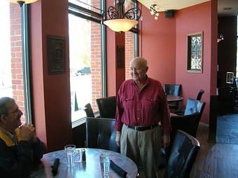 Interior: Jack talking with guest - Jack Niemann's Black Forest Steakhouse in Blaine, WA Steak House Restaurants