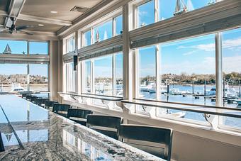 Interior: 360 degrees water views in our dining room and bar! - Mile Marker One Restaurant & Bar in Gloucester, MA American Restaurants