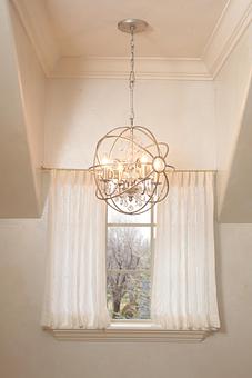 Interior: Panache offers an incredible selection of lighting.  This sphere chandelier adds the perfect amount of glam to this bedroom. - Panache in Wolflin Village - Amarillo, TX Business Services