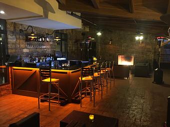 Interior: Both Vista and Trackside Terraces feature a cozy fireplace. - Rails Steakhouse in Towaco, NJ Steak House Restaurants