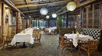 Interior: Trader Vic's Main Dining Room encompasses an island-inspired motif complete with palm-thatched ceilings, Tiki torches & authentic Polynesian wood carvings - Trader Vic's in Downtown - Atlanta, GA American Restaurants Interior: Trader Vic's Main Dining Room encompasses an island-inspired motif complete with palm-thatched ceilings, Tiki torches & authentic Polynesian wood carvings - Trader Vic's in Downtown - Atlanta, GA American Restaurants